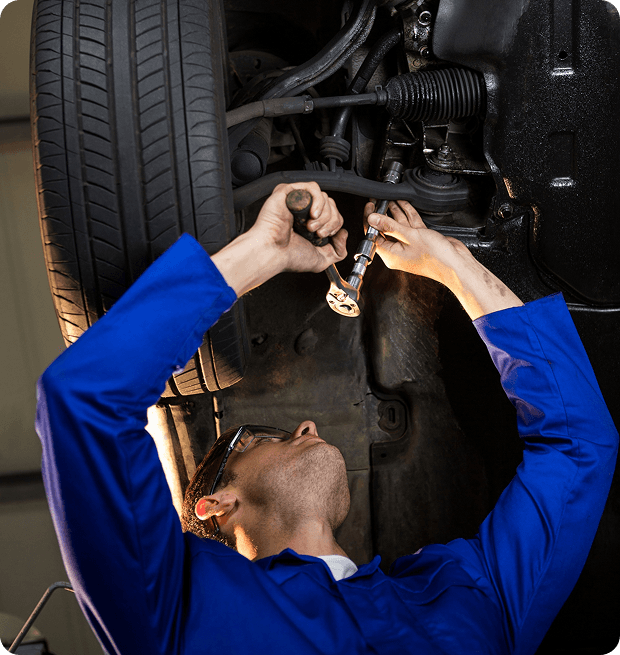 Mechanic under car